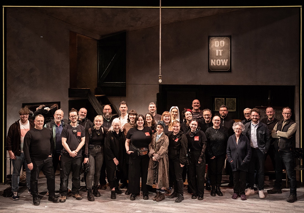 A large group photo on the Three Short Comedies set