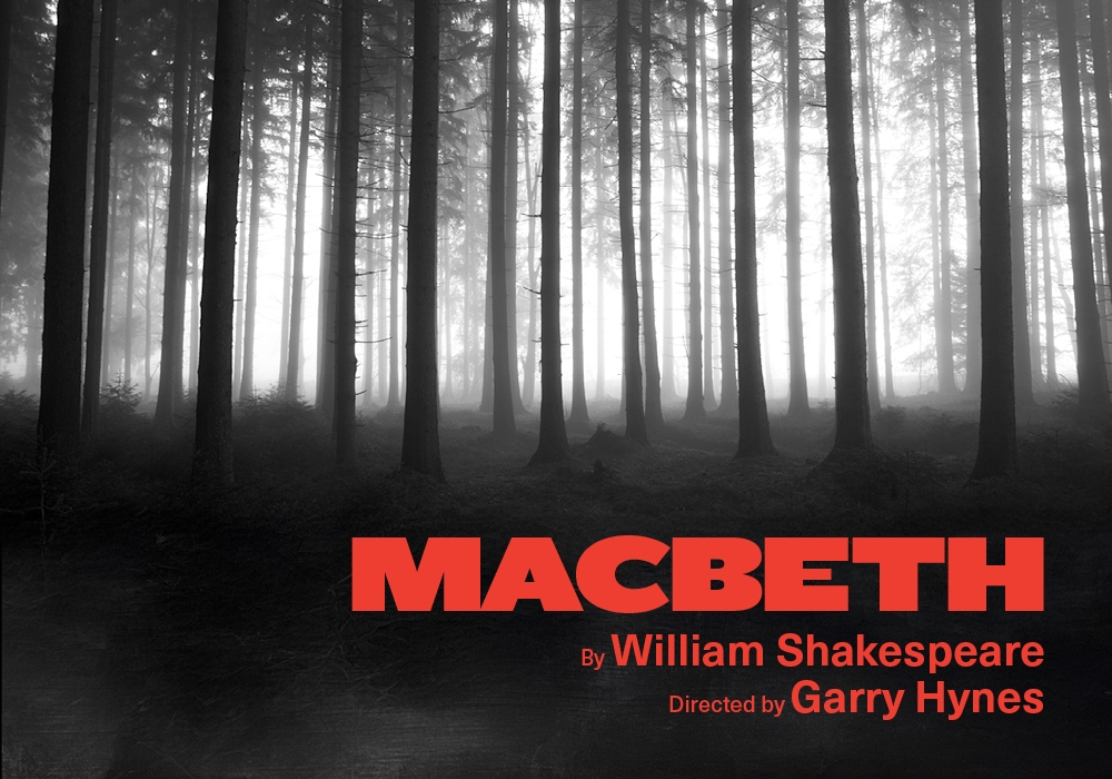 A black-and-white photograph of a forest of trees. In the bottom right in red is the show title and names of the writer and director.