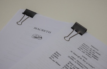 A photo of two play scripts on a table.