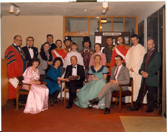 A colour photo of a large group of people featuring the company of Shakespeare's Much Ado About Nothing with President of Ireland Patrick Hillery and other dignitaries at the opening of the Hawk's Well Theatre in Sligo.