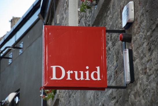 The red Druid sign hanging above the theatre on Druid Lane.