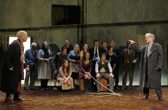 A large group photo featuring 16 actors in a scene from The Well of the Saints by J. M. Synge as part of DruidSynge.