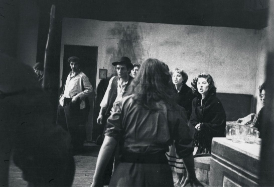 A black-and-white production photo of The Playboy of the Western World featuring a large cast on stage.