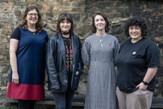 A group photo of four recipients of the Marie Mullen Bursary.