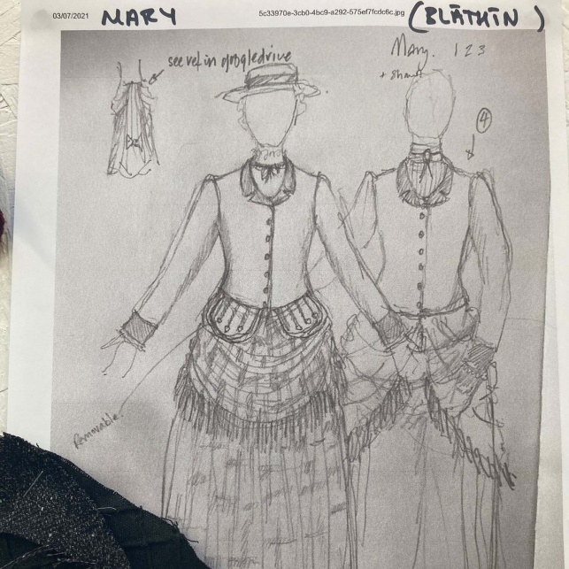 			Costume design sketch with swatches for the character of Mary.