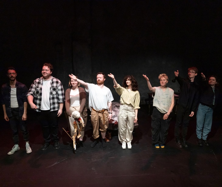 A line of people take their bows onstage at The Mick Lally Theatre.