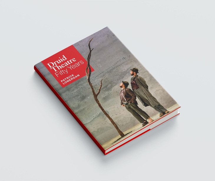 A book on a grey background