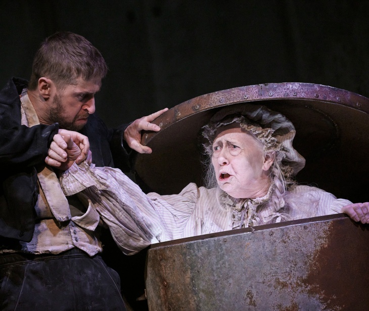 Aaron Monaghan pushes Marie Mullen into a large trashcan in a scene from Samuel Beckett's Endgame.