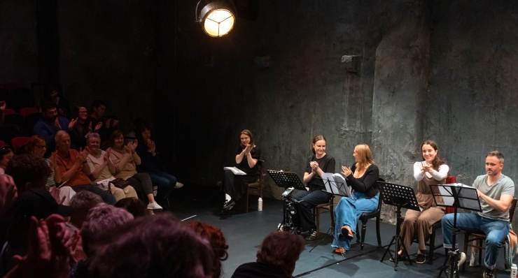 A play reading at The Mick Lally Theatre as part of Druid Debuts 2024 with a view of both the audience and the actors on the stage.