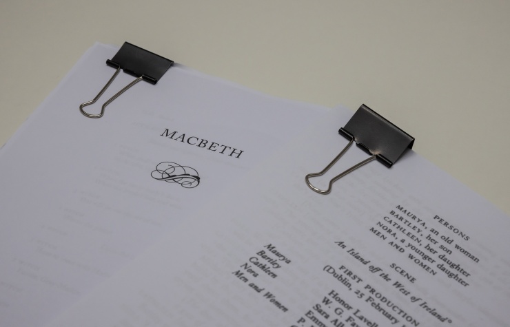 A photo of two play scripts on a table.
