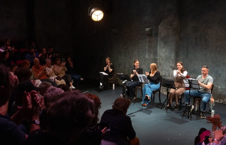 A play reading at The Mick Lally Theatre as part of Druid Debuts 2024 with a view of both the audience and the actors on the stage.